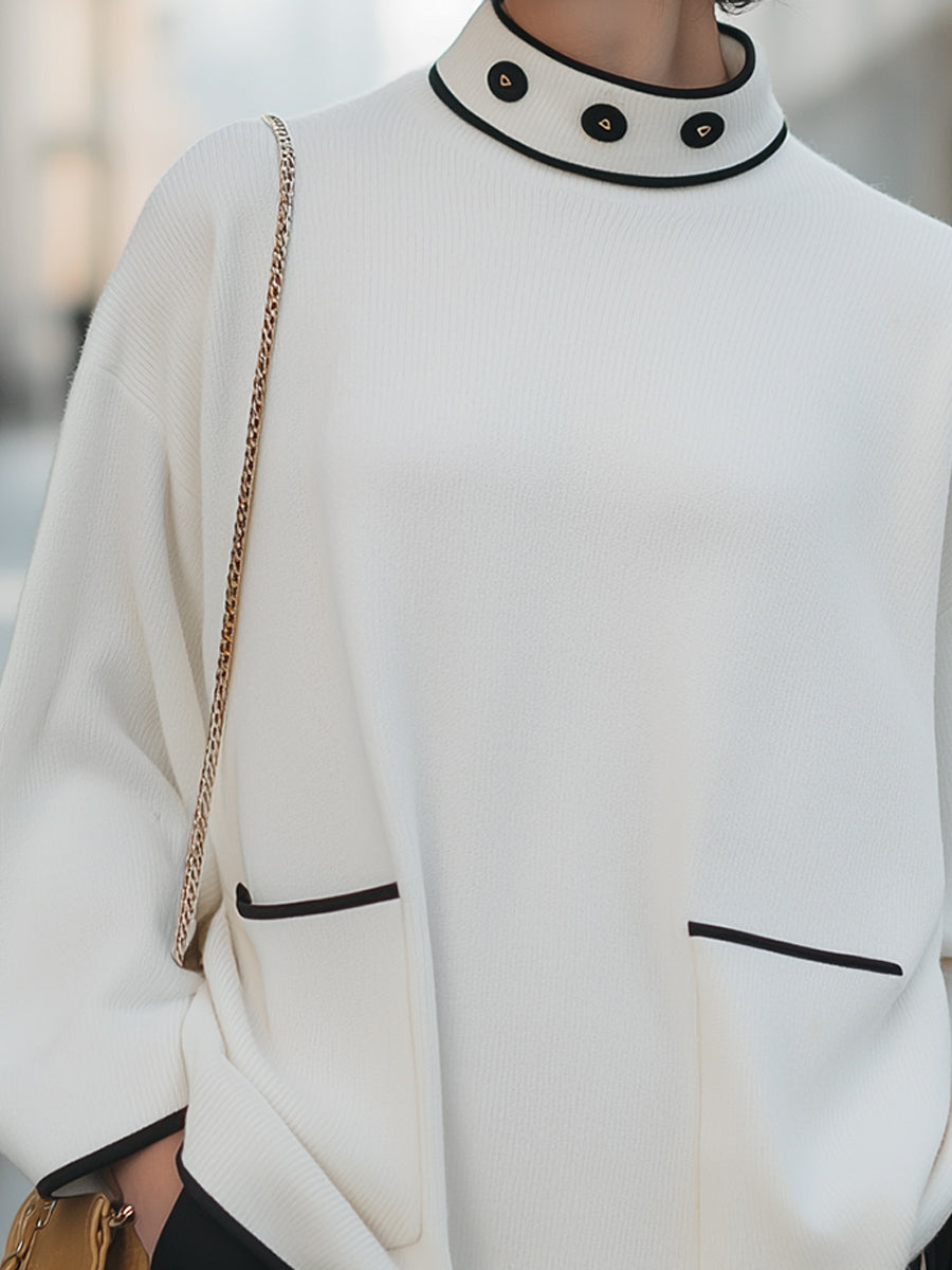 High-Neck Relaxed Sweater With Black Trim And Button Accents