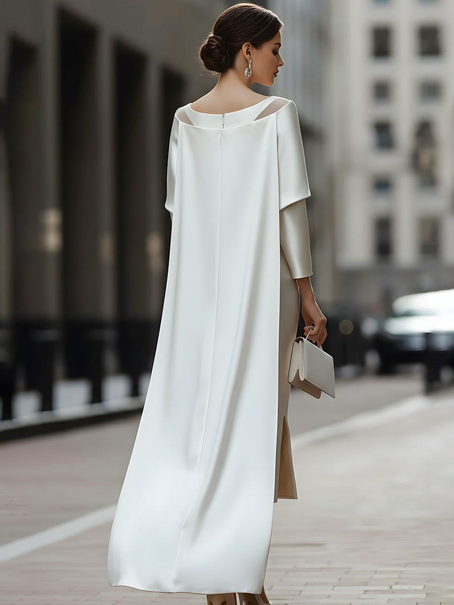 An Elegant Off-The-Shoulder Satin Cape Dress With A Sheer Neckline.
